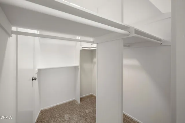 a view of a balcony with wooden fence and floor