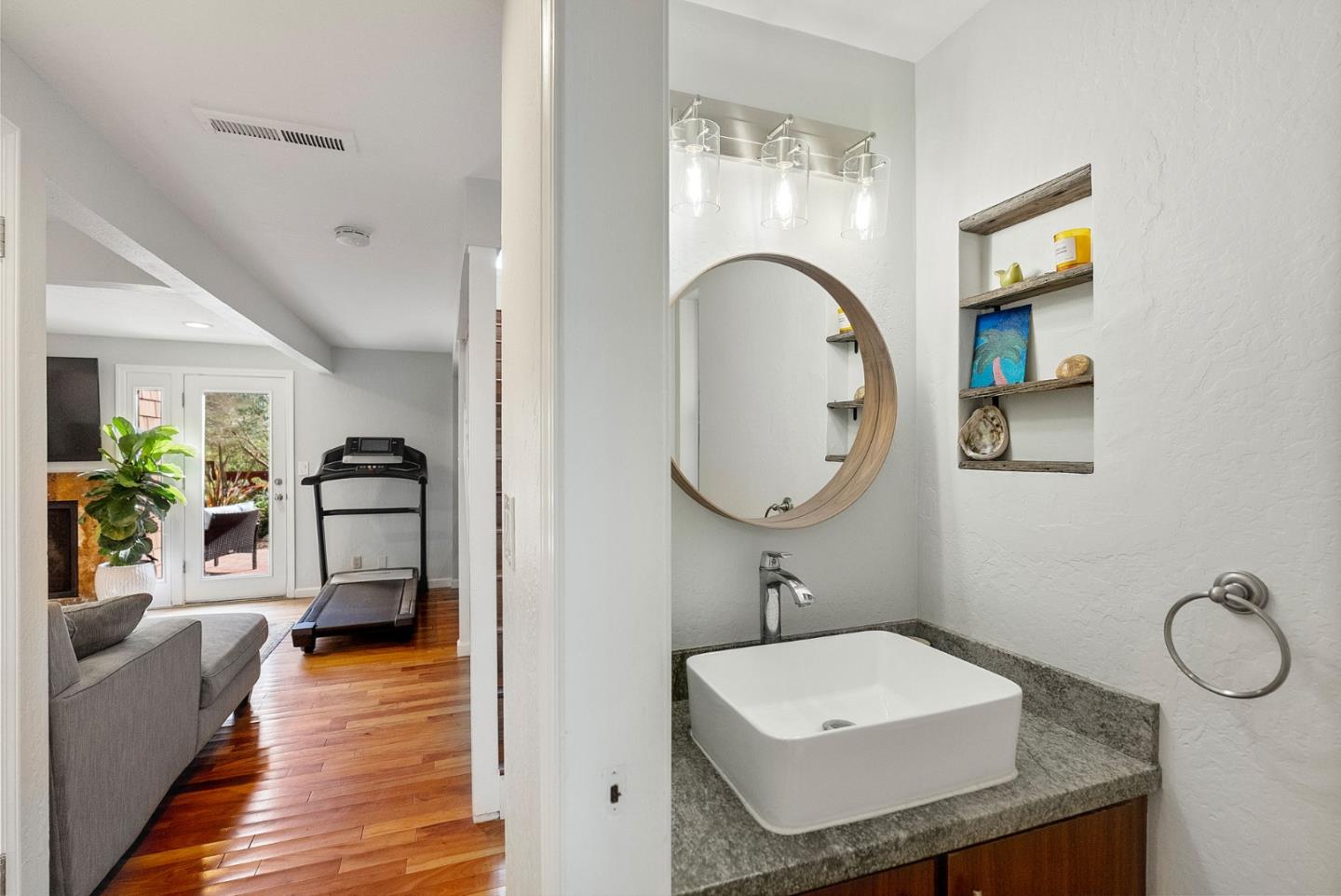 165 Bar Harbor Court Aptos, CA 95003 - Photo 14 of 37 a en suite bathroom with a granite countertop sink and a mirror