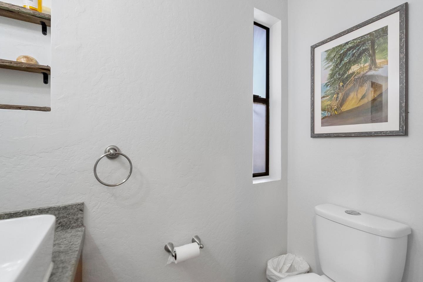 165 Bar Harbor Court Aptos, CA 95003 - Photo 15 of 37 a bathroom with a toilet a sink and mirror