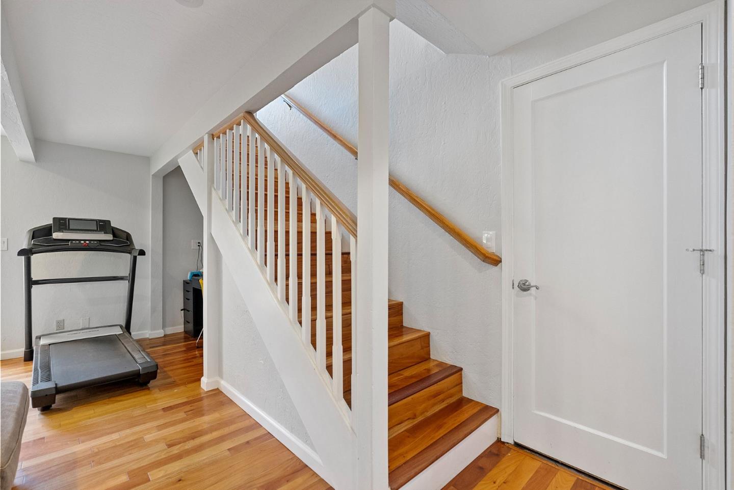 165 Bar Harbor Court Aptos, CA 95003 - Photo 16 of 37 a view of staircase with wooden floor and a rug