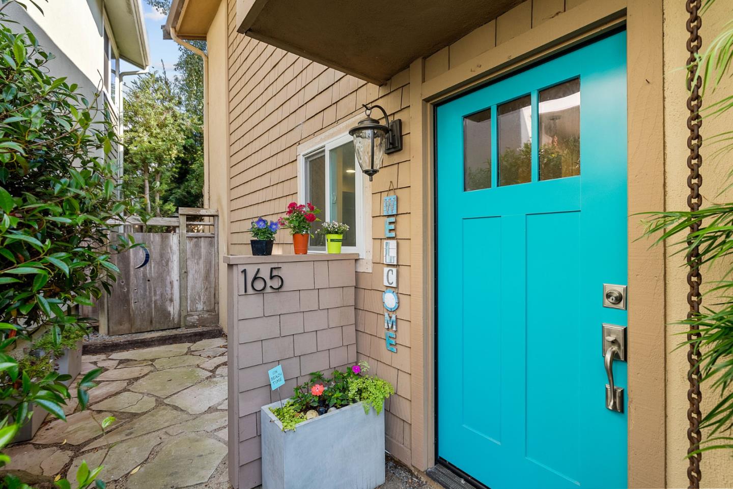 165 Bar Harbor Court Aptos, CA 95003 - Photo 2 of 37 a house view with a potted plant in front of a door