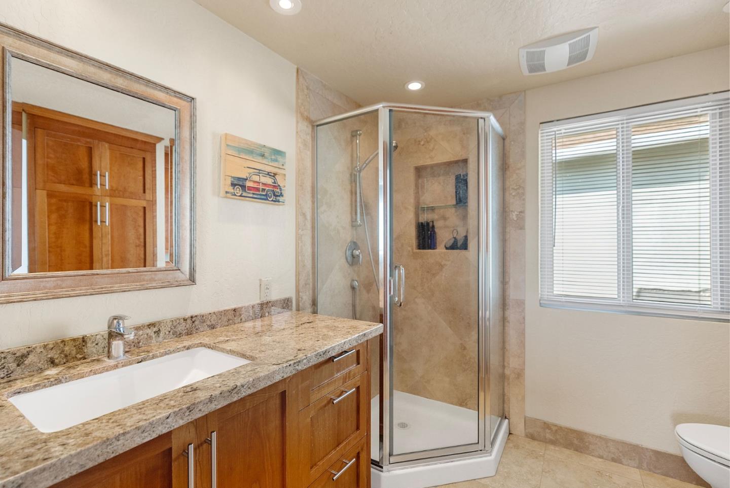 165 Bar Harbor Court Aptos, CA 95003 - Photo 25 of 37 a bathroom with a granite countertop sink and a mirror