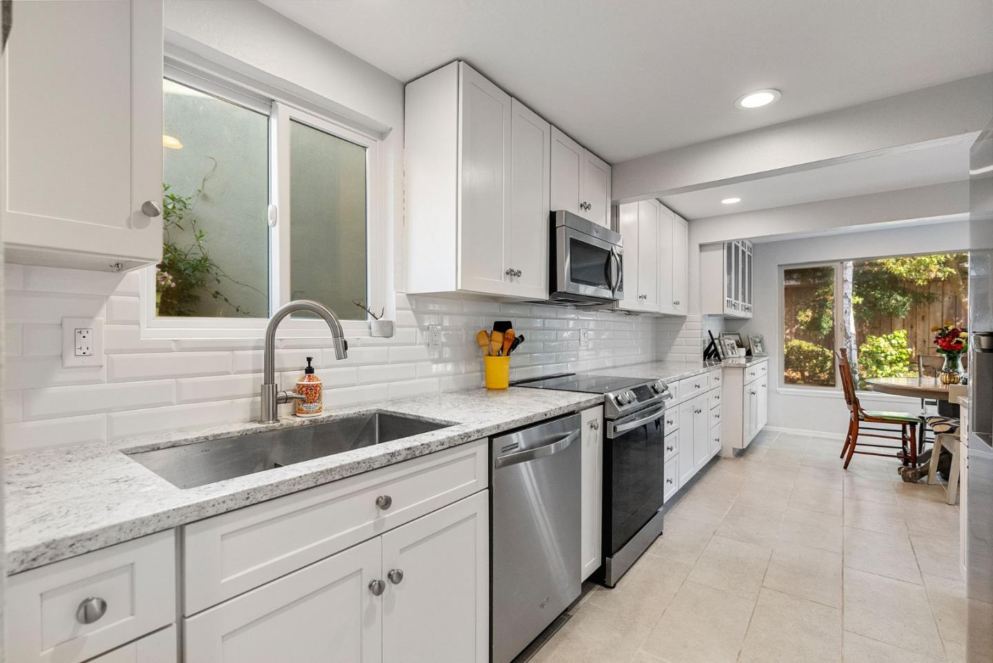 165 Bar Harbor Court Aptos, CA 95003 - Photo 7 of 37 a kitchen with stainless steel appliances granite countertop a sink and cabinets
