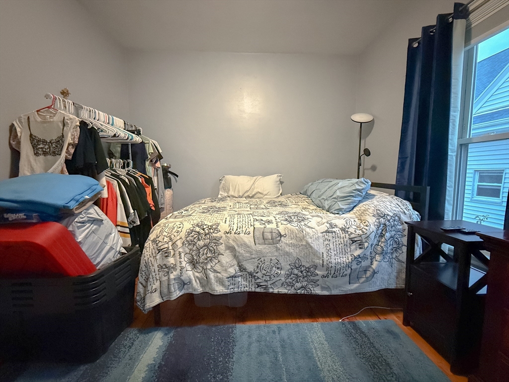 173 Elm Street, Unit 2 Braintree, MA 02184 - Photo 12 of 20 a bedroom with a bed and a closet