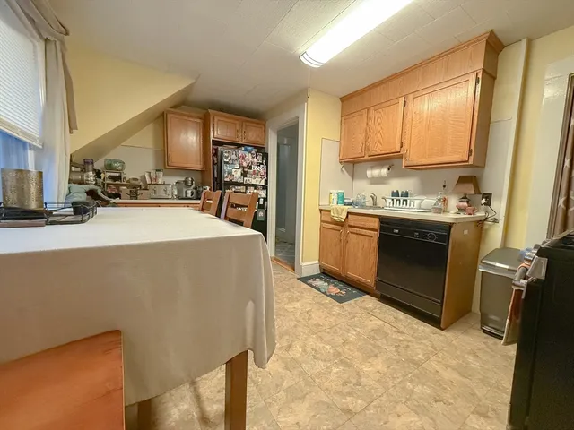 a kitchen with sink cabinets and window