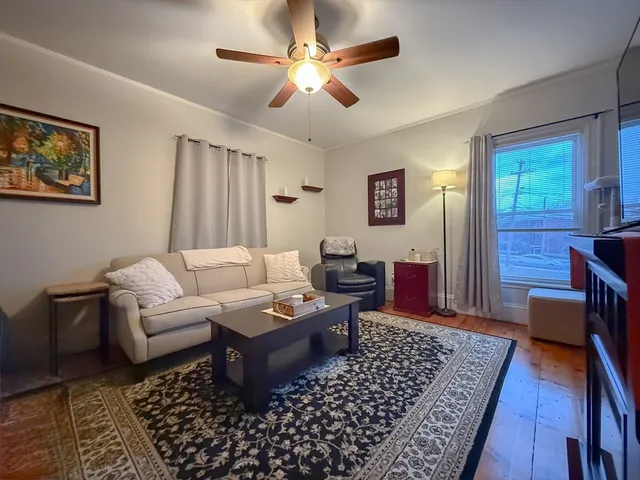 a living room with furniture and a rug