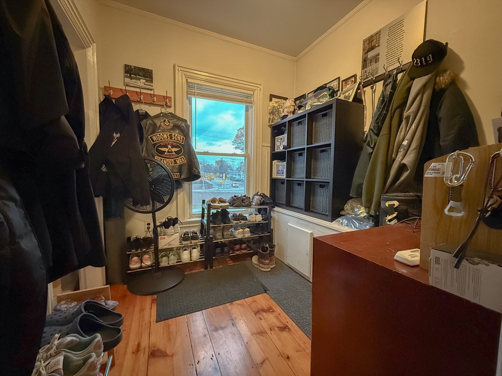 173 Elm Street, Unit 2 Braintree, MA 02184 - Photo 6 of 20 a living room with furniture and a flat screen tv