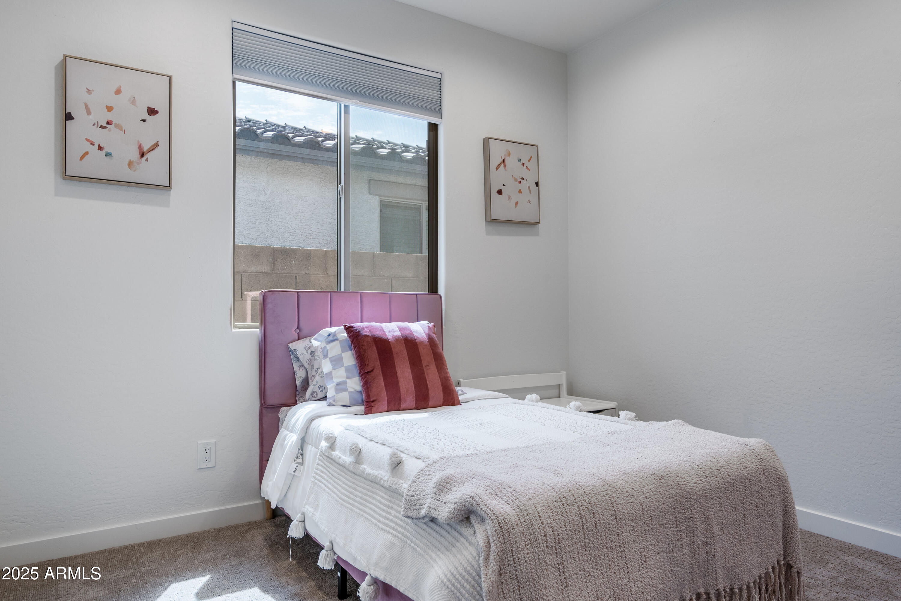 18365 West Ewers Drive Surprise, AZ 85374 - Photo 11 of 18 a bedroom with a bed and painting on the wall