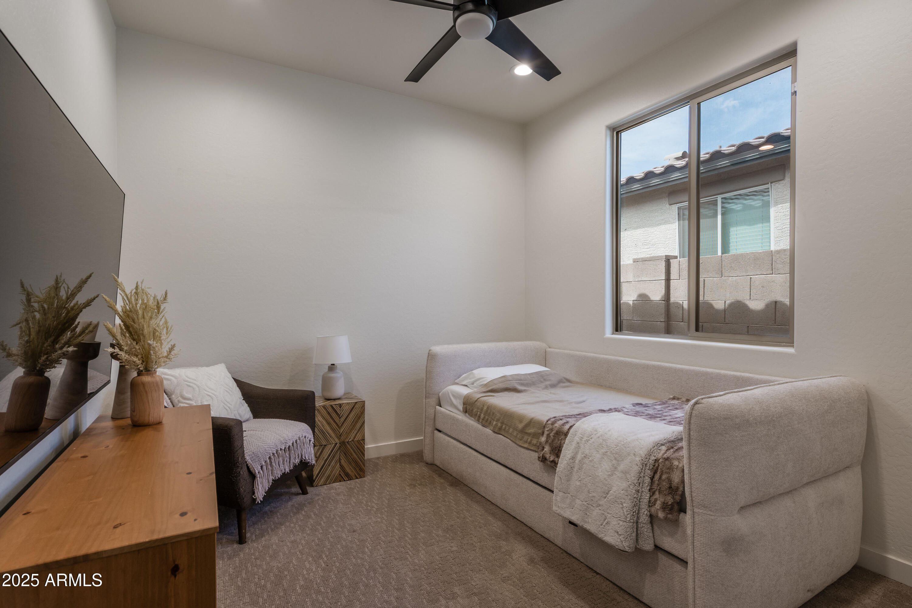 18365 West Ewers Drive Surprise, AZ 85374 - Photo 12 of 18 a bedroom with a bed window and couch