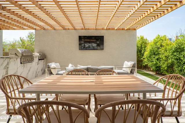 a view of a dining room with furniture and window
