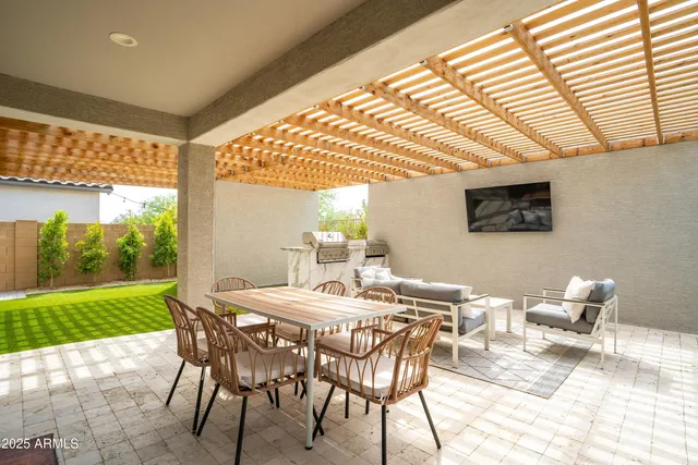 a view of an outside dining space with furniture
