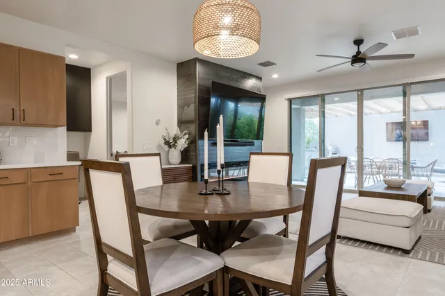 a view of a dining room with furniture window and outside view