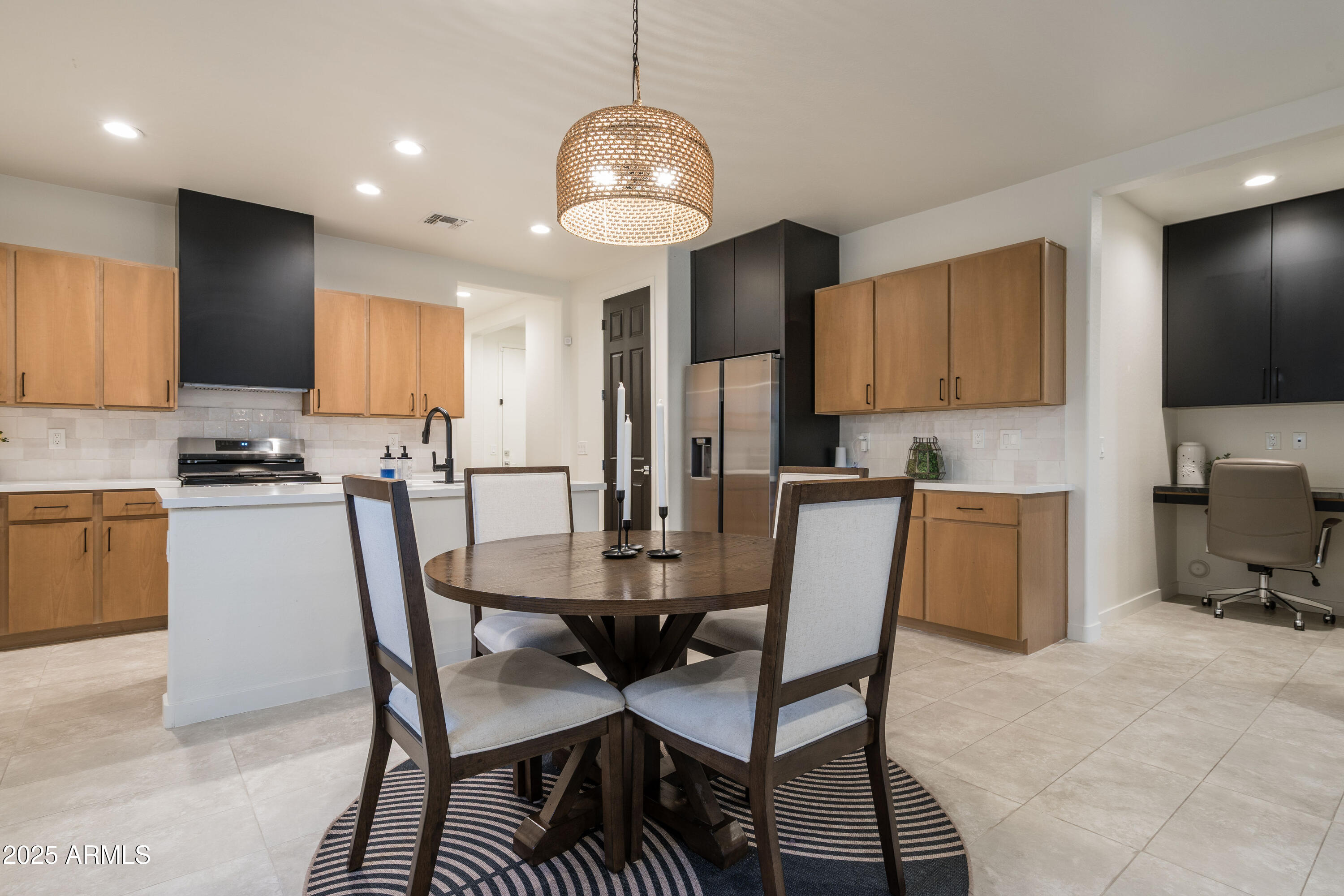 18365 West Ewers Drive Surprise, AZ 85374 - Photo 4 of 18 a view of a dining room with furniture and wooden floor