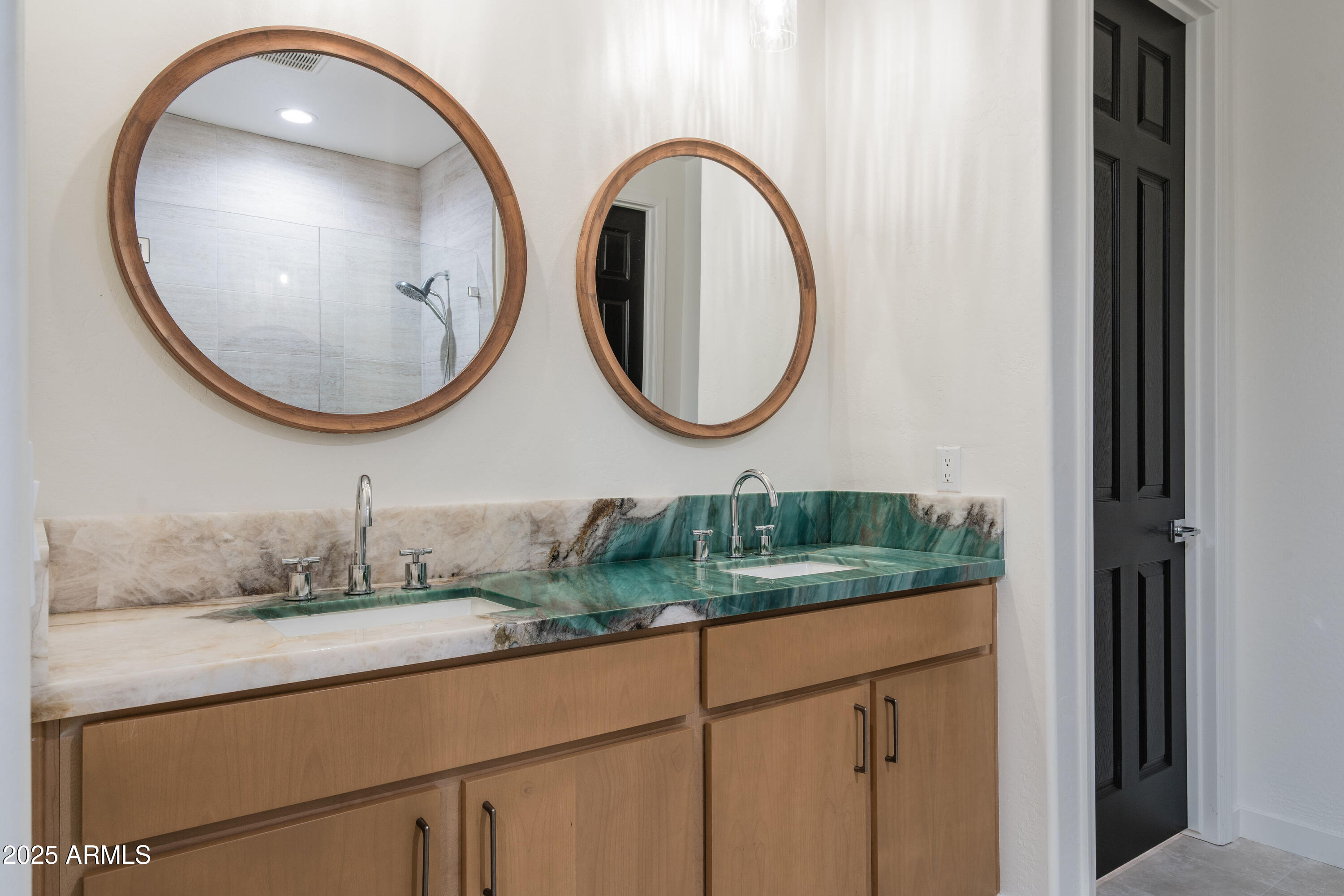 18365 West Ewers Drive Surprise, AZ 85374 - Photo 10 of 18 a bathroom with a sink and a mirror