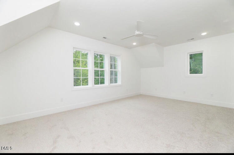 1407 Onslow Road Raleigh, NC 27606 - Photo 3 of 7 an empty room with windows