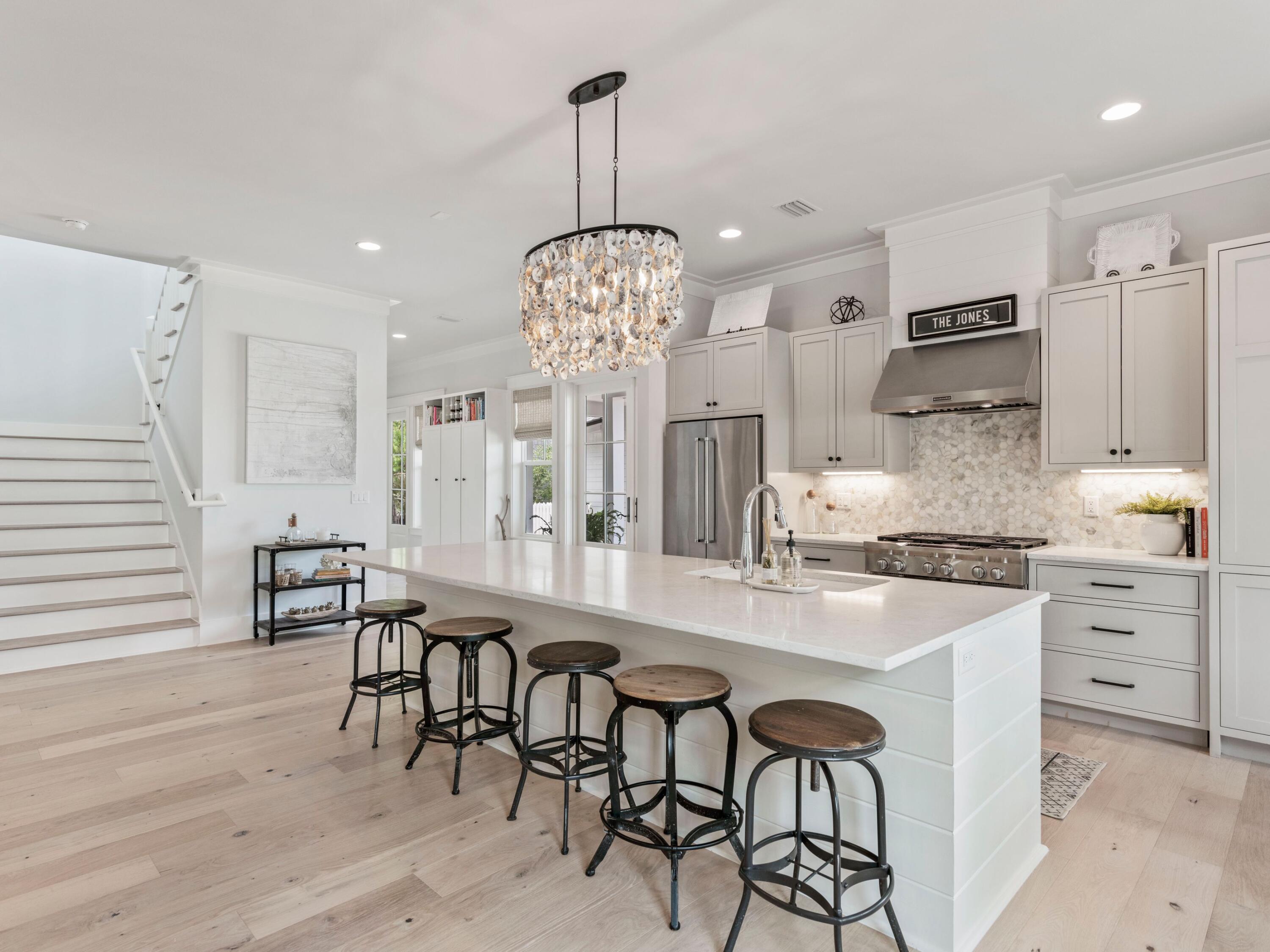 193 Splash Drive Inlet Beach, FL 32461 - Photo 1 of 43 a kitchen with stainless steel appliances kitchen island granite countertop a table chairs sink and cabinets