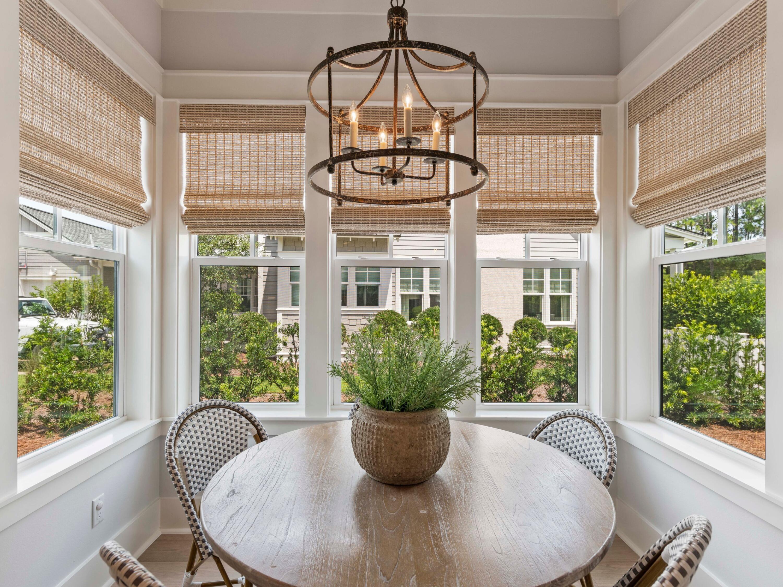 193 Splash Drive Inlet Beach, FL 32461 - Photo 12 of 43 a dining room with glass windows and furniture