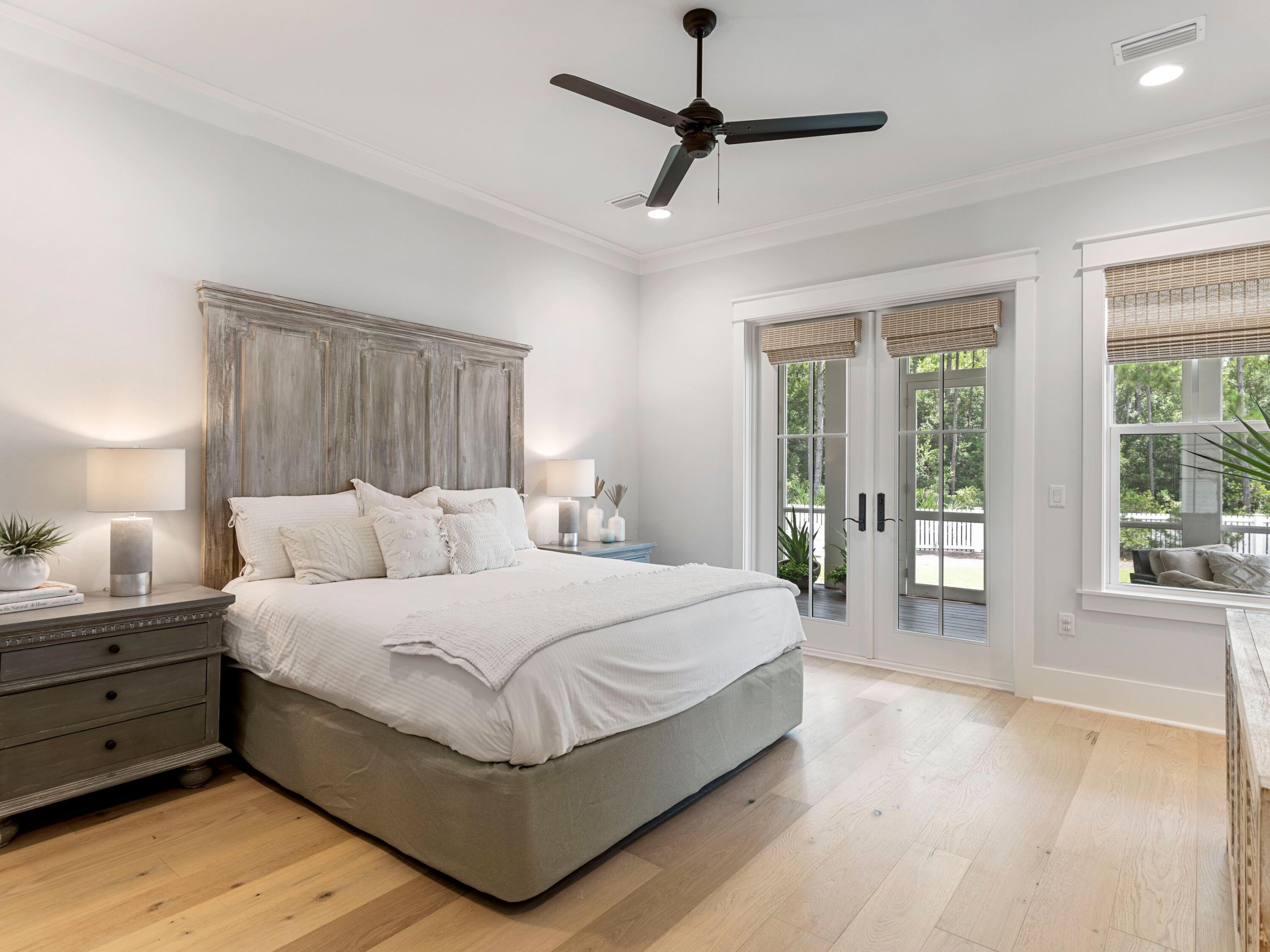 193 Splash Drive Inlet Beach, FL 32461 - Photo 17 of 43 a spacious bedroom with a large bed and a window