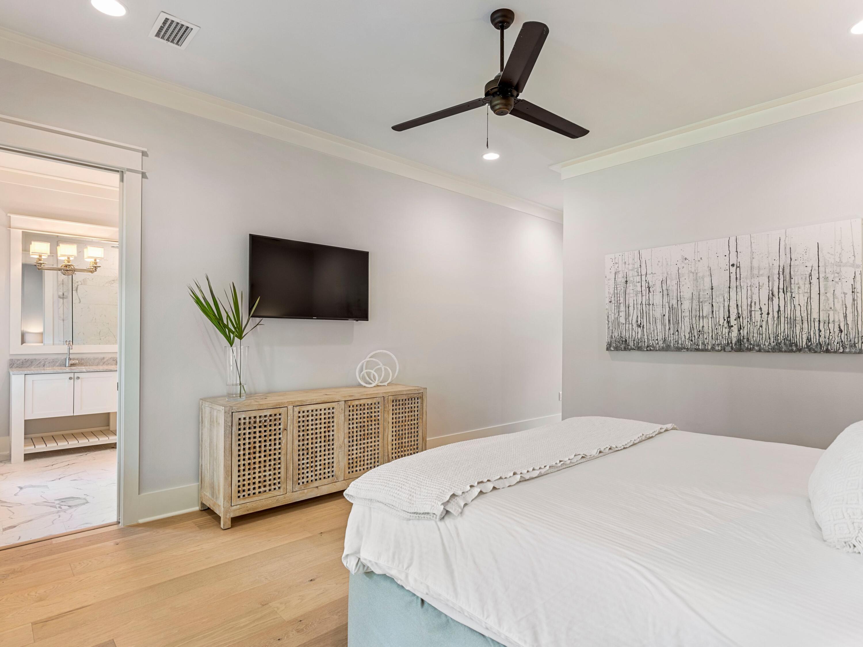 193 Splash Drive Inlet Beach, FL 32461 - Photo 19 of 43 a bedroom with a bed and a flat screen tv