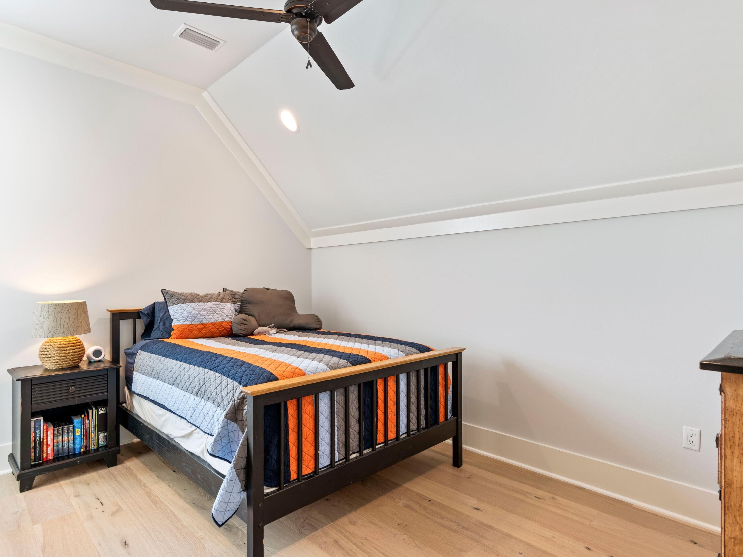 193 Splash Drive Inlet Beach, FL 32461 - Photo 29 of 43 a bedroom with a bed and wooden floor