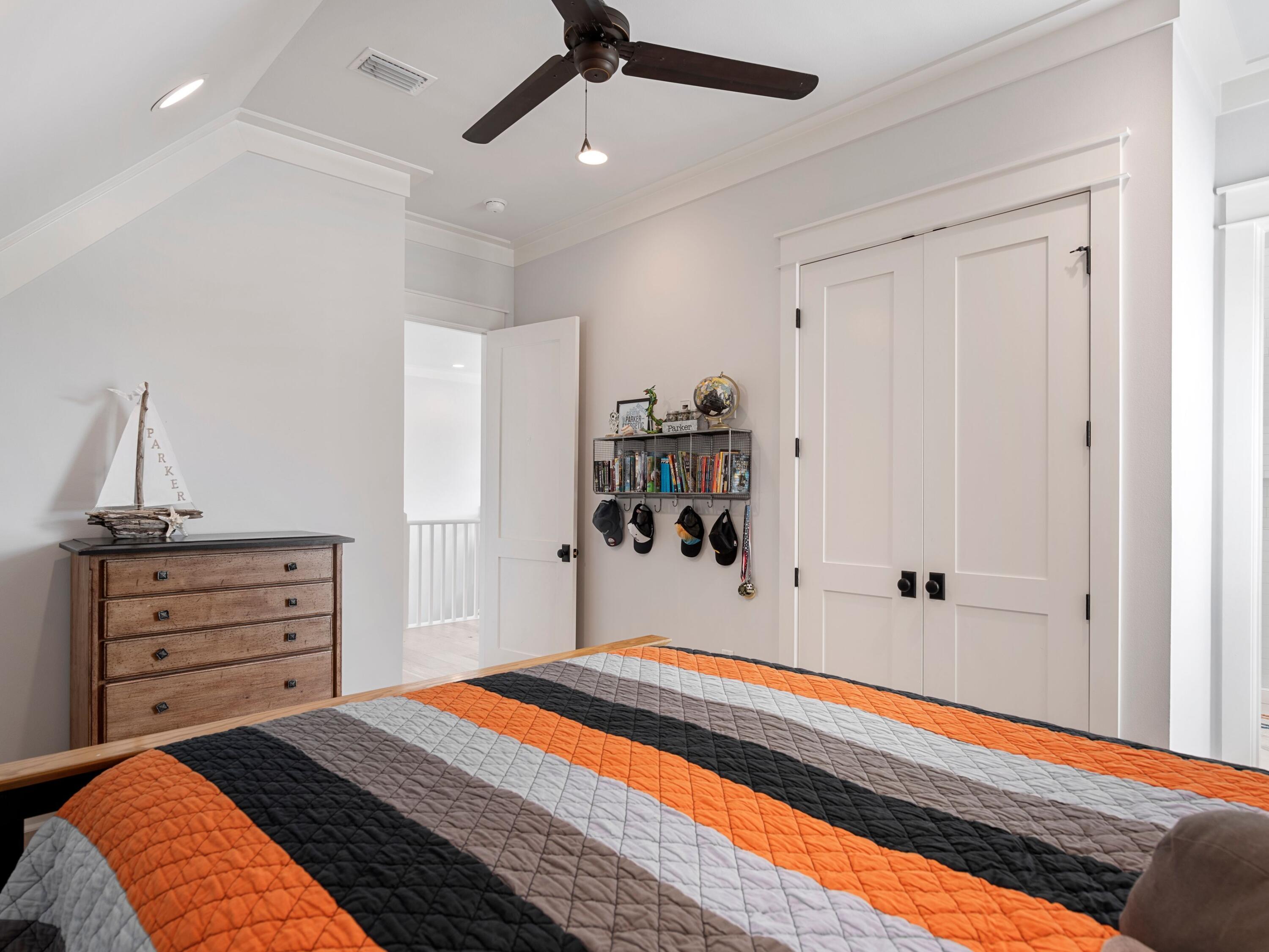 193 Splash Drive Inlet Beach, FL 32461 - Photo 31 of 43 a bedroom with a bed and a chandelier