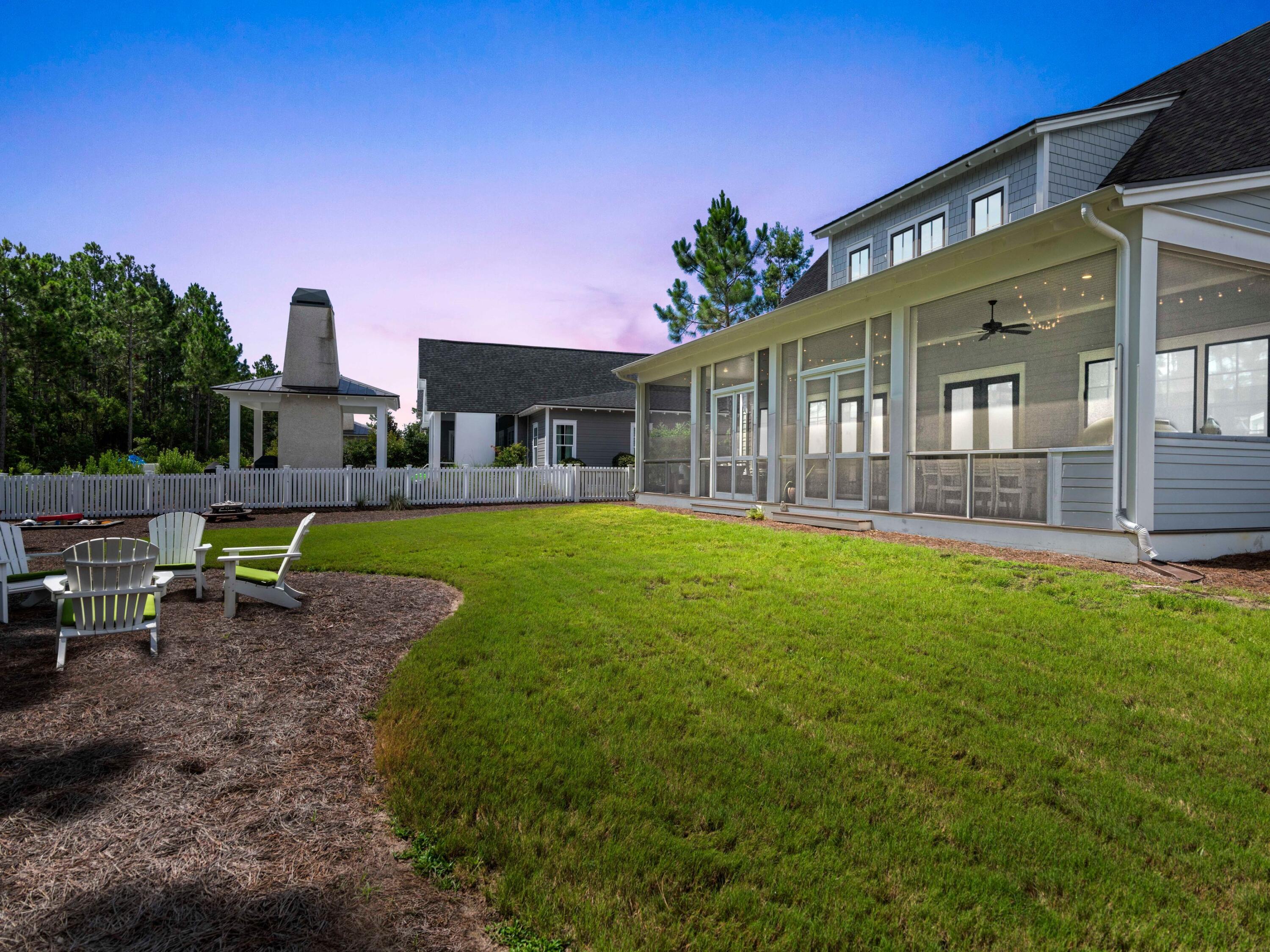 193 Splash Drive Inlet Beach, FL 32461 - Photo 5 of 43 a front view of a house with a garden and patio