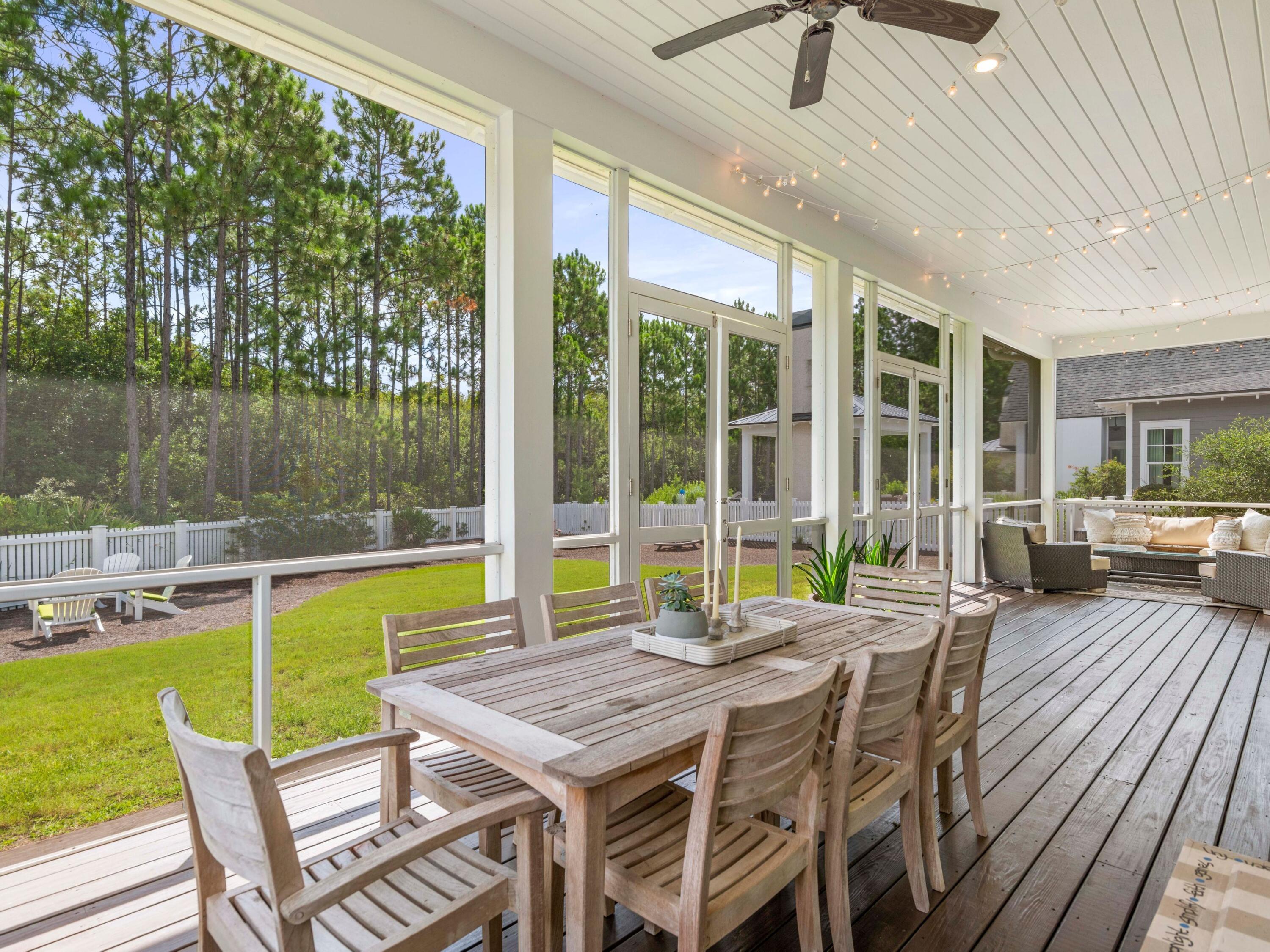 193 Splash Drive Inlet Beach, FL 32461 - Photo 8 of 43 a view of a patio with a table chairs and a swimming pool