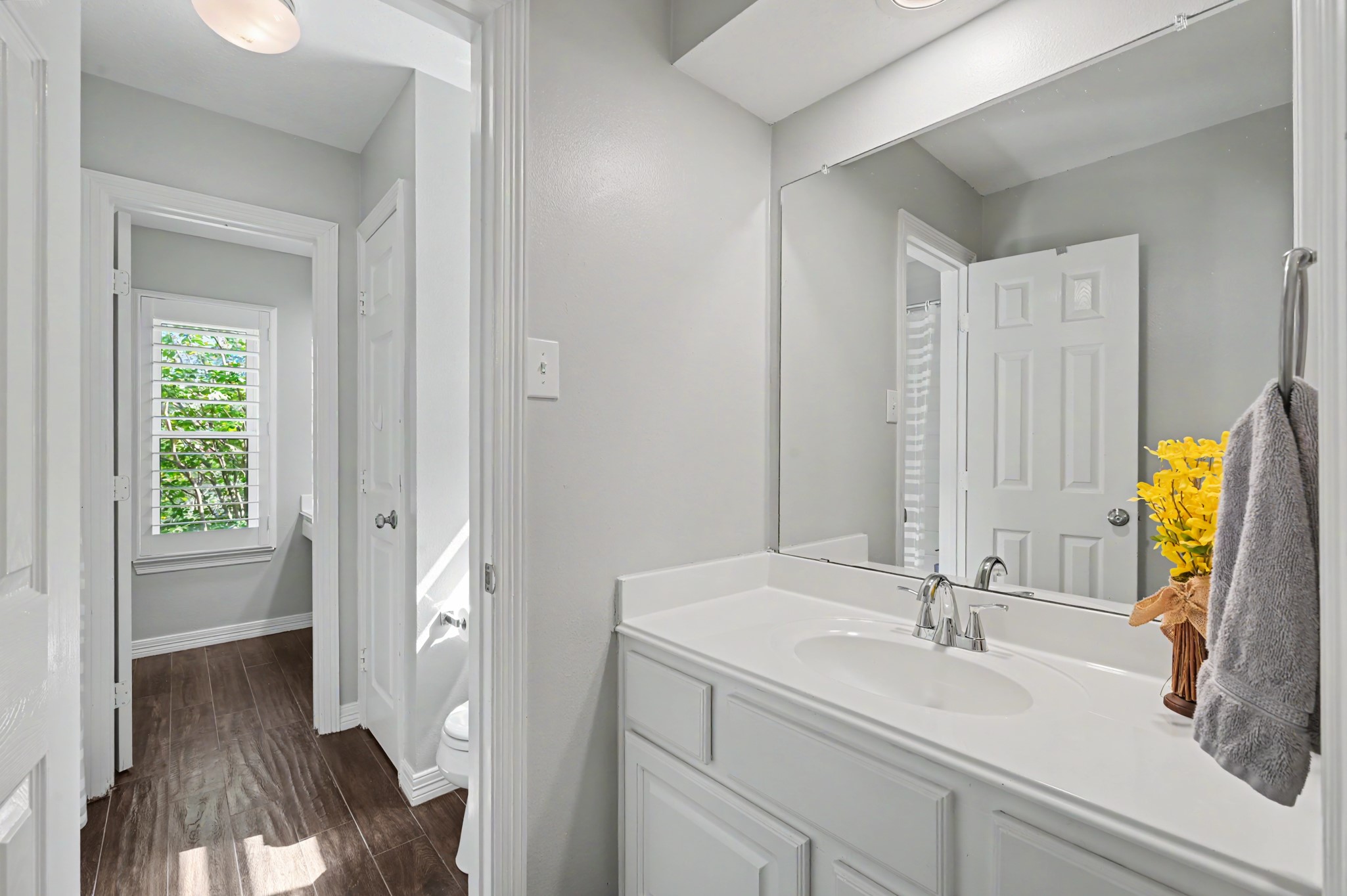 14938 Codys Run Cypress, TX 77429 - Photo 32 of 50 The floors have been upgraded to wood-look tile and the neutral colors continue in these two bedrooms and bathroom. There is a tub/shower combo in this bathroom, as well.