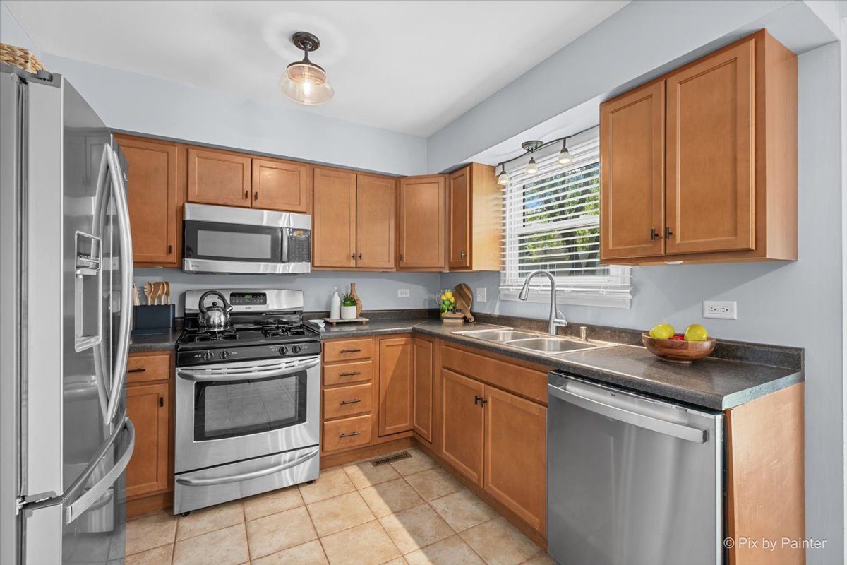 1150 Appleton Lane Geneva, IL 60134 - Photo 3 of 43 a kitchen with a sink stove top oven and microwave