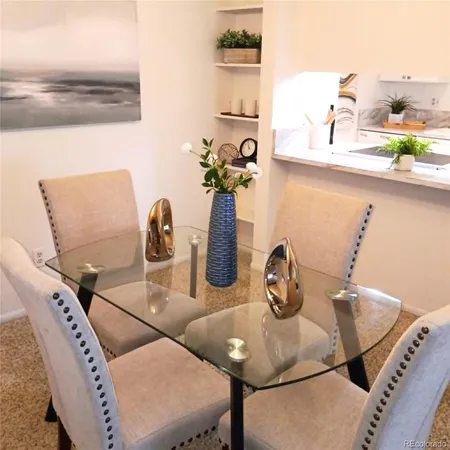 a kitchen with a sink a counter and cabinets