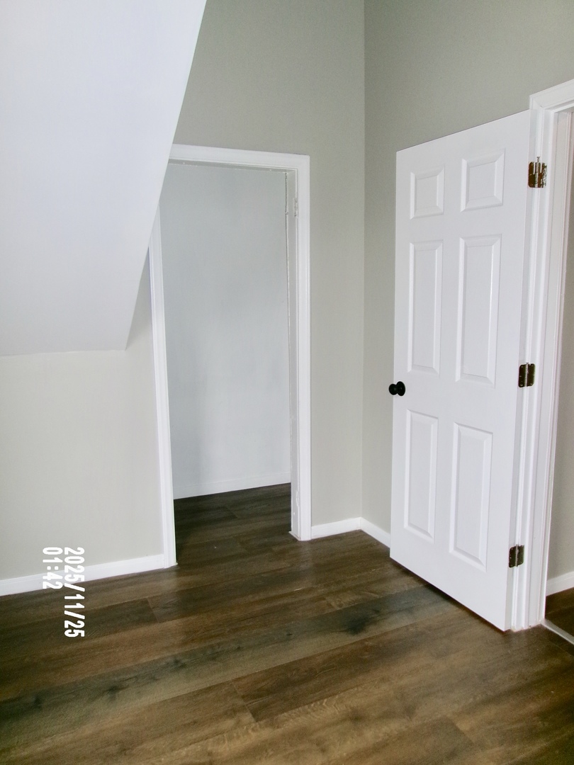 2852 East 91st Street, Unit 2 Chicago, IL 60617 - Photo 11 of 22 a view of empty room with wooden floor