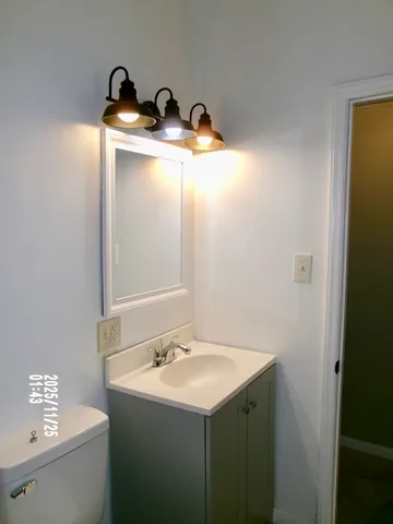 a bathroom with a sink and vanity