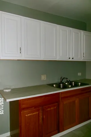 a kitchen with a sink and cabinets