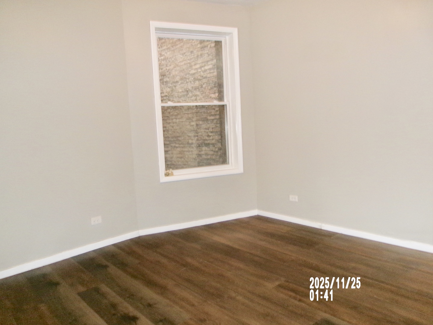 2852 East 91st Street, Unit 2 Chicago, IL 60617 - Photo 7 of 22 an empty room with wooden floor and windows