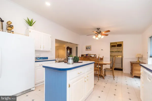 a kitchen with a sink appliances and cabinets