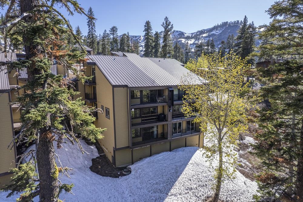 2090 Chalet Road, Unit 4 Alpine Meadows, CA 96146 - Photo 5 of 28 a view of a house with a yard and balcony