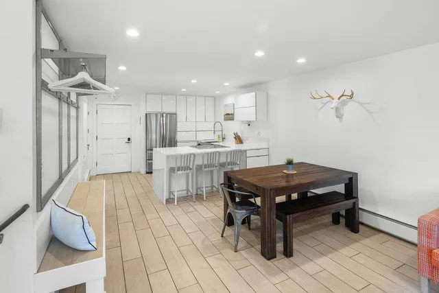 a kitchen with stainless steel appliances a refrigerator and a sink