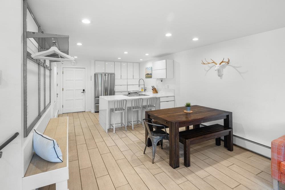 2090 Chalet Road, Unit 4 Alpine Meadows, CA 96146 - Photo 7 of 28 a room with table chairs and wooden floor