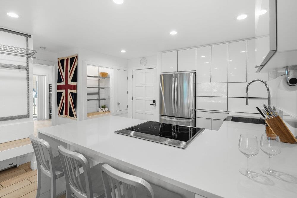 2090 Chalet Road, Unit 4 Alpine Meadows, CA 96146 - Photo 8 of 28 a kitchen with stainless steel appliances a refrigerator and a sink