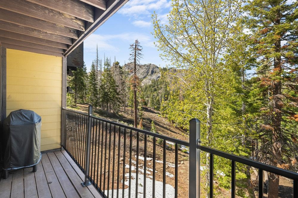2090 Chalet Road, Unit 4 Alpine Meadows, CA 96146 - Photo 8 of 28 a view of a balcony with wooden floor and bench
