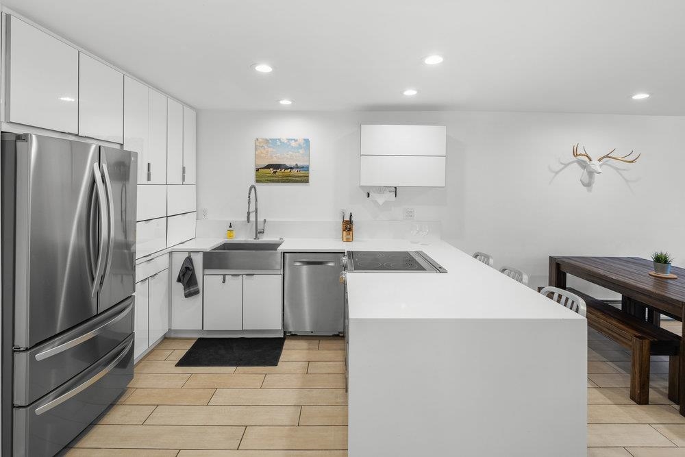 2090 Chalet Road, Unit 4 Alpine Meadows, CA 96146 - Photo 9 of 28 a kitchen with a sink appliances and cabinets