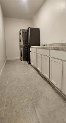 a view of a kitchen with refrigerator and microwave