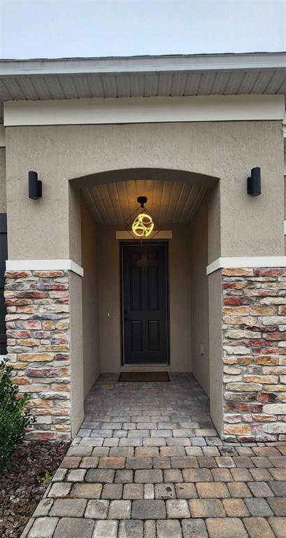 13795 Southwest 137th Way Newberry, FL 32669 - Photo 2 of 26 a view of entryway with a stairs