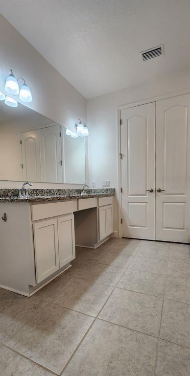 13795 Southwest 137th Way Newberry, FL 32669 - Photo 21 of 26 a large white kitchen with a sink and cabinets