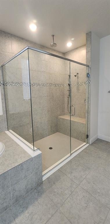 13795 Southwest 137th Way Newberry, FL 32669 - Photo 23 of 26 a bathroom with a shower and a glass door