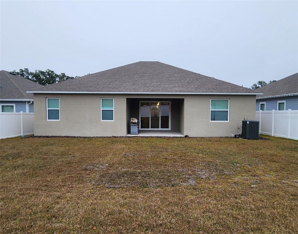 13795 Southwest 137th Way Newberry, FL 32669 - Photo 25 of 26 a house with yard in front of it