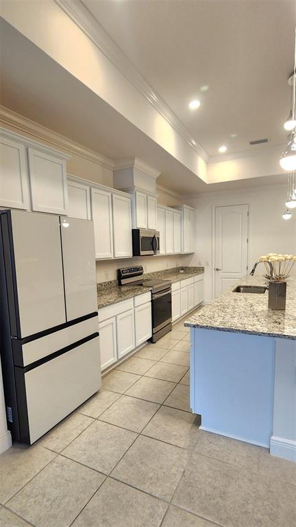 13795 Southwest 137th Way Newberry, FL 32669 - Photo 9 of 26 a kitchen with granite countertop cabinets and white stainless steel appliances