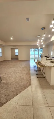 a kitchen with a sink and a stove top oven