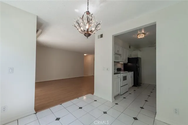 a view of a hallway with a chandelier