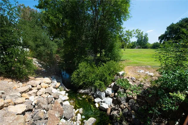 a backyard of a house with lots of green space